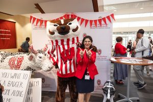 Dean Dean Nita Ahuja poses with Bucky Badger.
