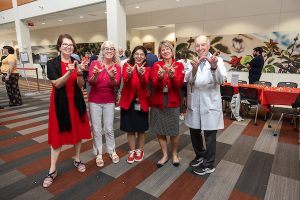 Dean Nita Ahuja and other SMPH faculty pose at the Wisco Welcome event.
