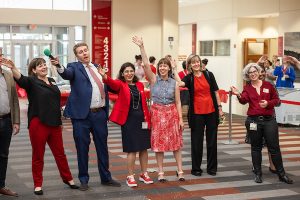 Dean Nita Ahuja and other SMPH faculty wave to others.