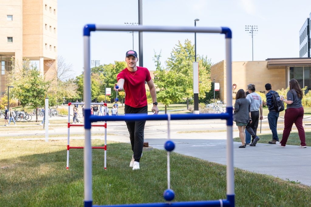 A person plays ladder toss