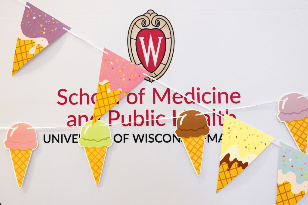 The SMPH logo with ice cream decorations over it.