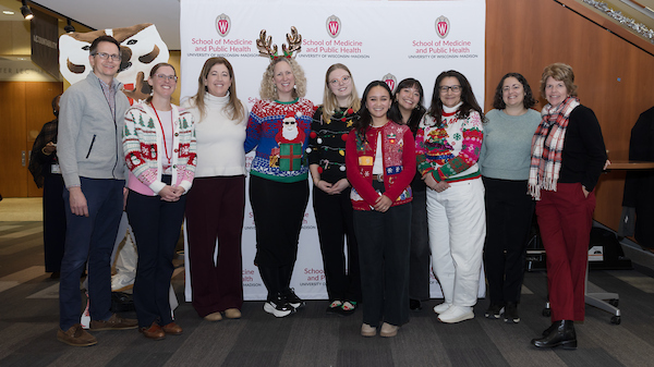 SMPH faculty pose at the 2025 SMPH Sweater Weather Social.