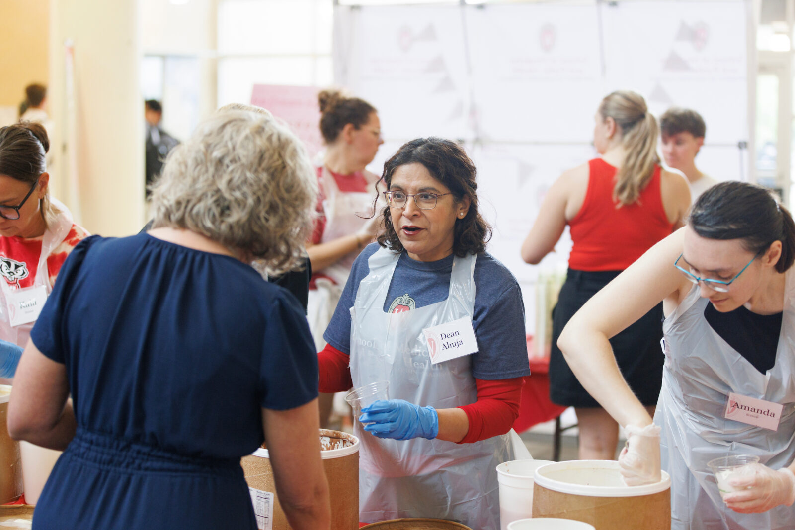 Dean Ahuja serves Babcock ice cream at the SMPH Ice Cream Social.